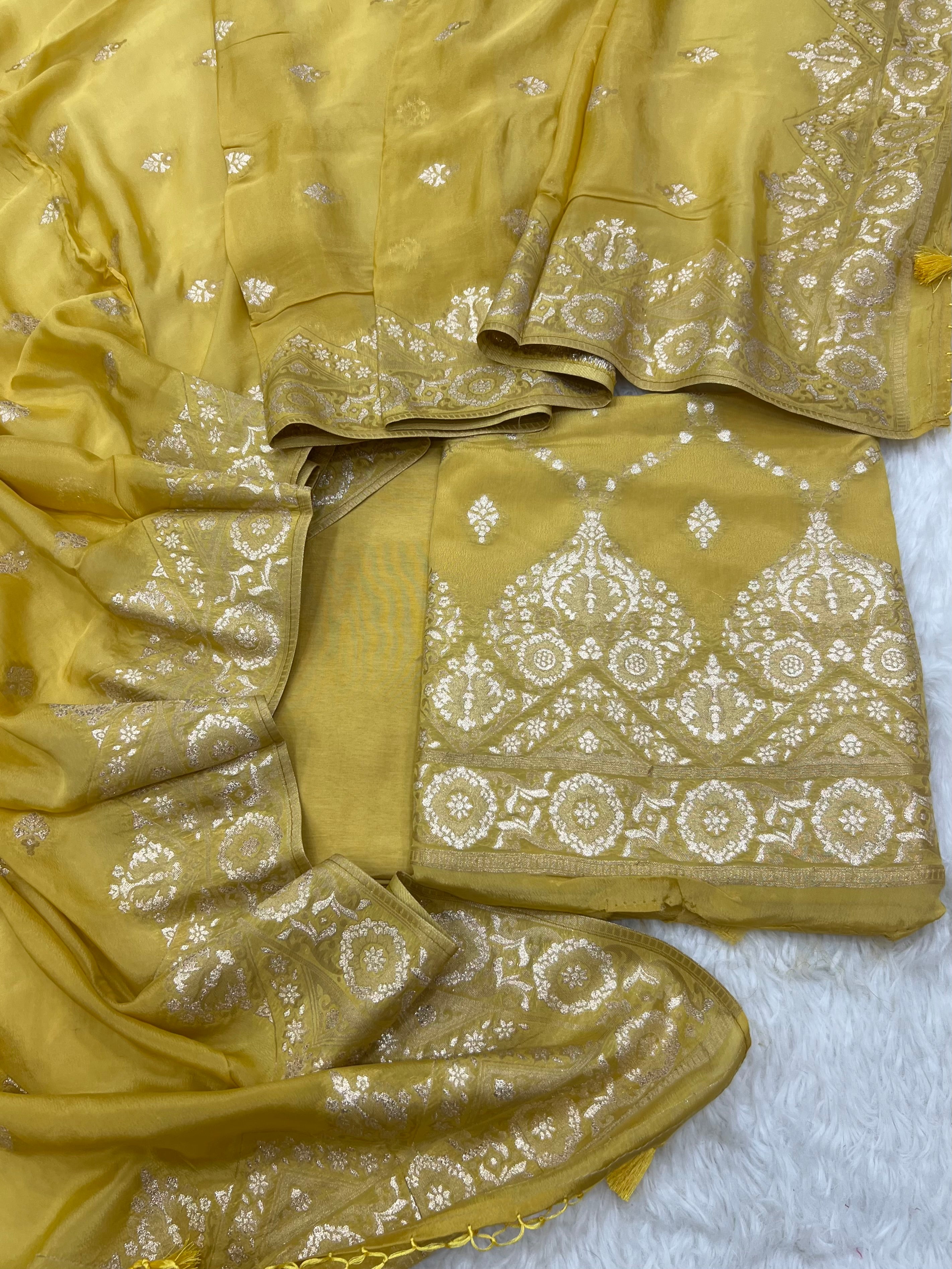 Pure crape antique almond zari weaved unstitched suits collections